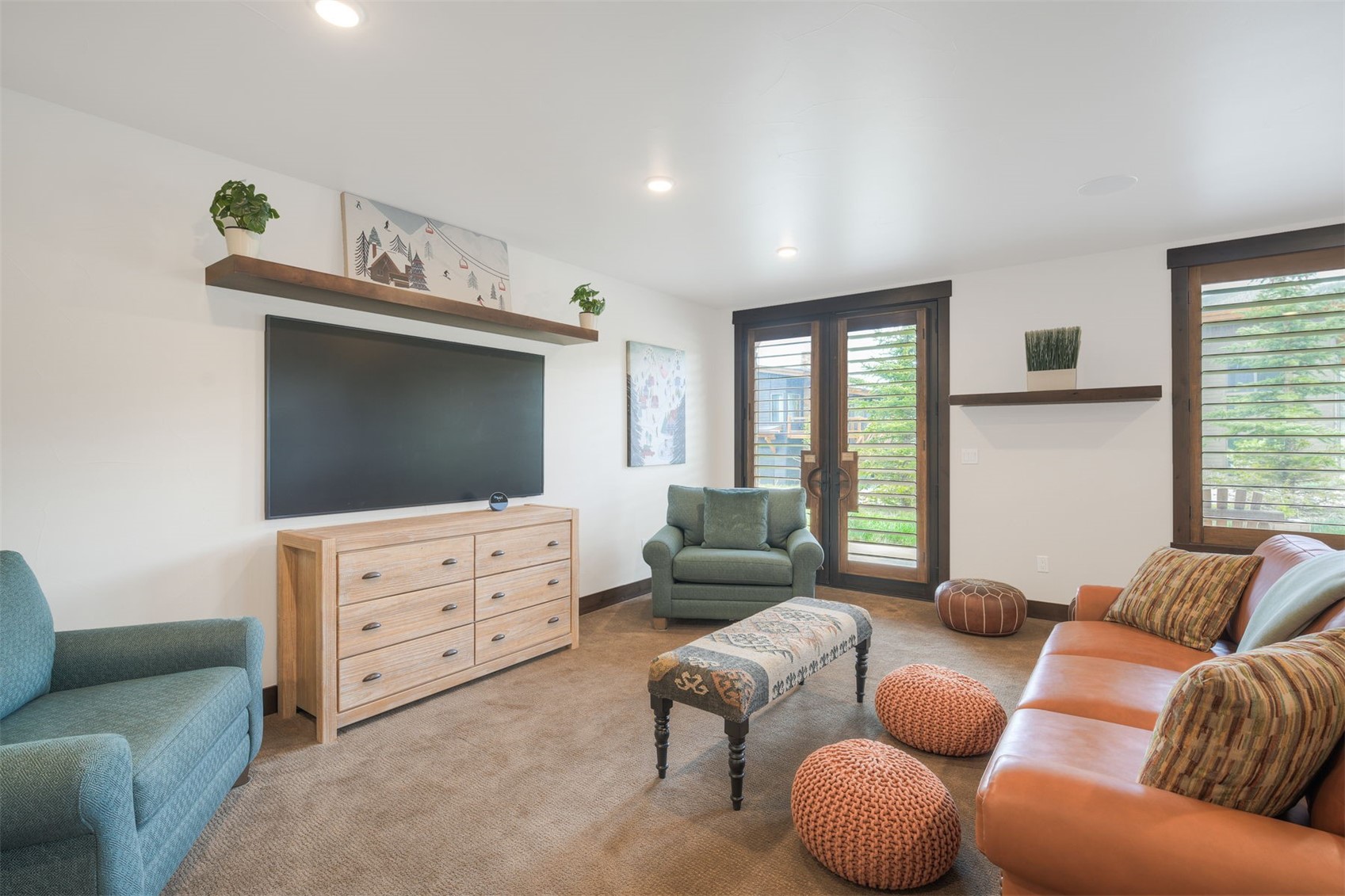 21 Moss Way Silverthorne, CO 80498 - Photo 26 of 50 a living room with furniture and a flat screen tv
