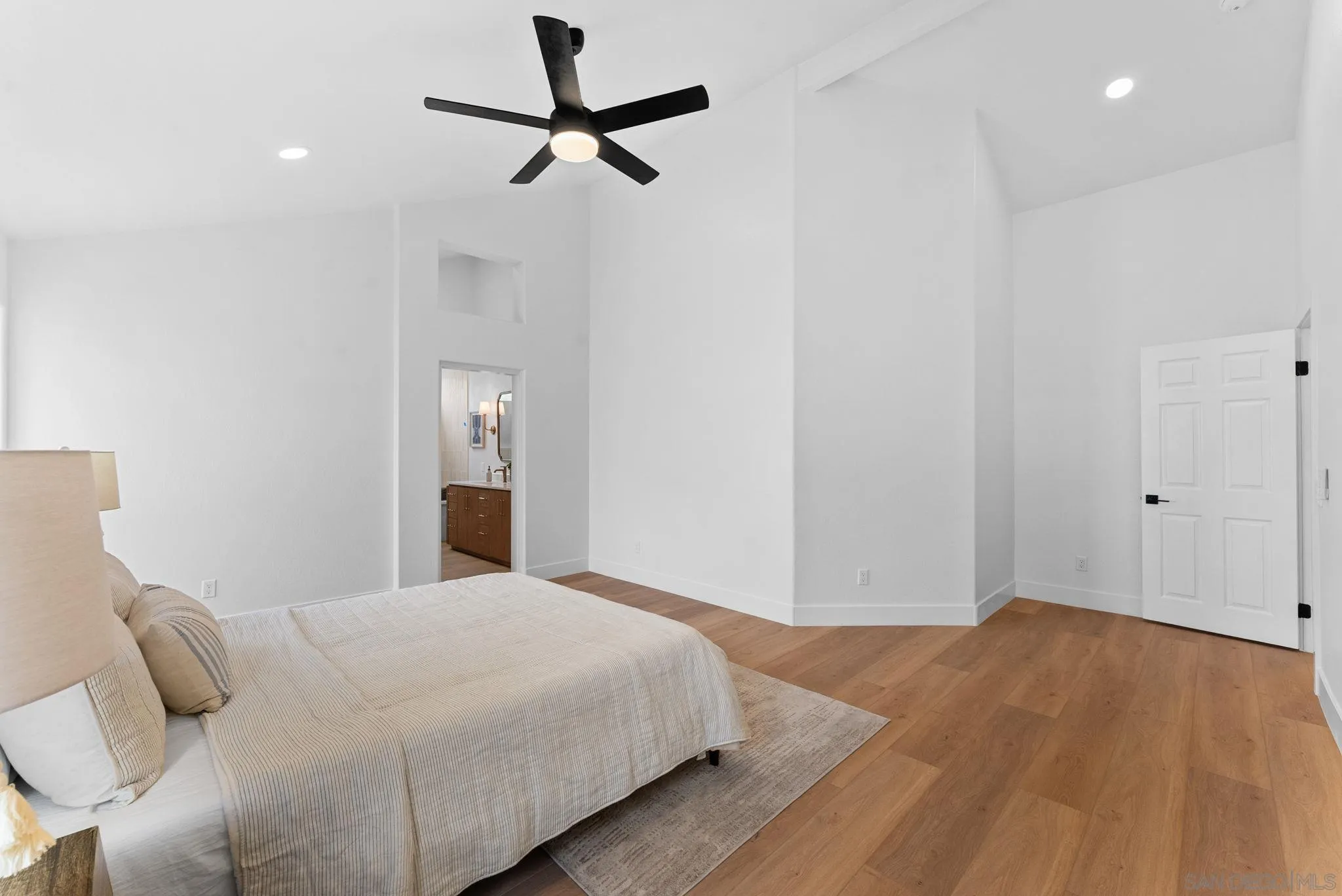 4695 Adra Way Oceanside, CA 92056 - Photo 19 of 29 a bedroom with a bed and a ceiling fan