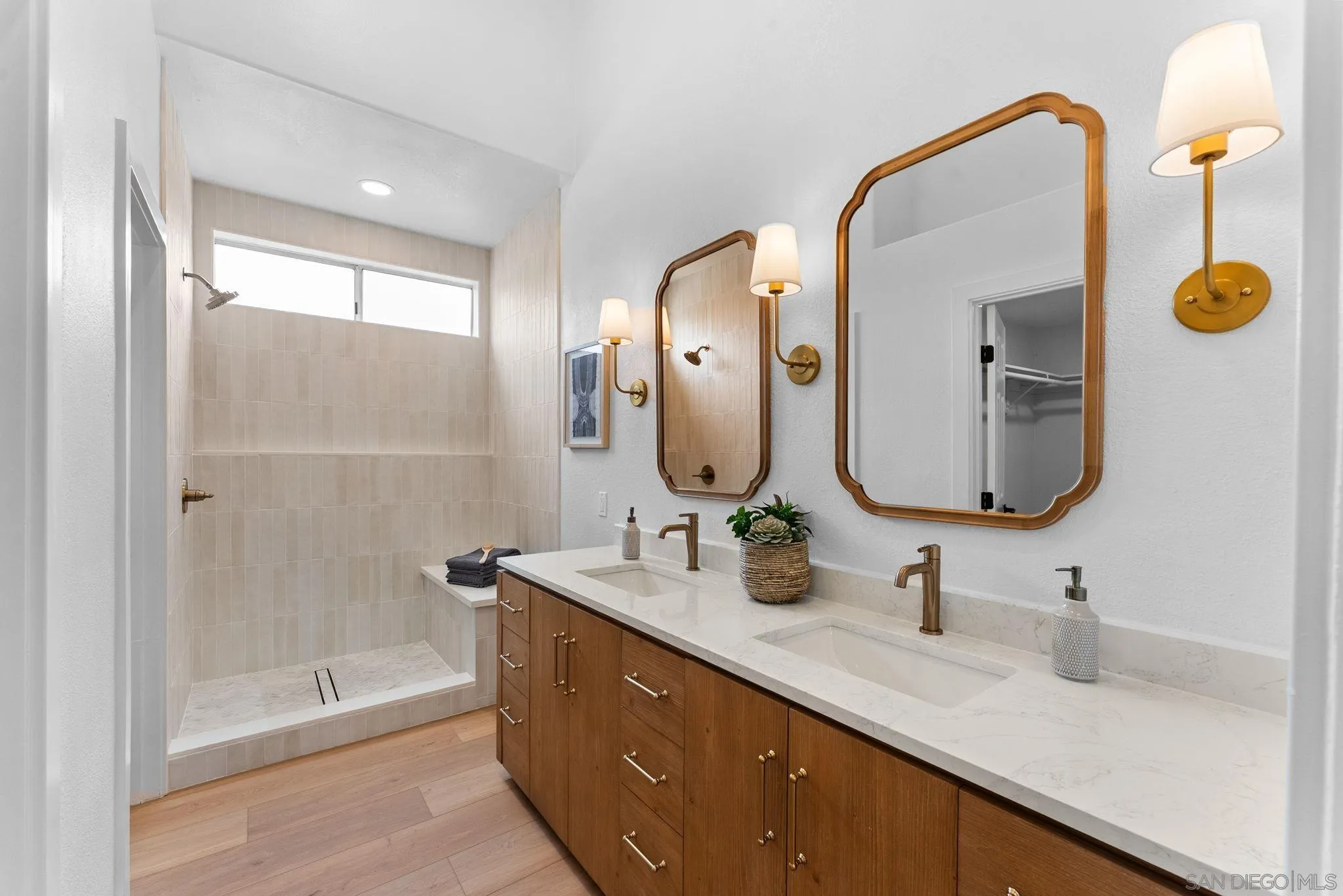 4695 Adra Way Oceanside, CA 92056 - Photo 20 of 29 a bathroom with a double vanity sink mirror and shower