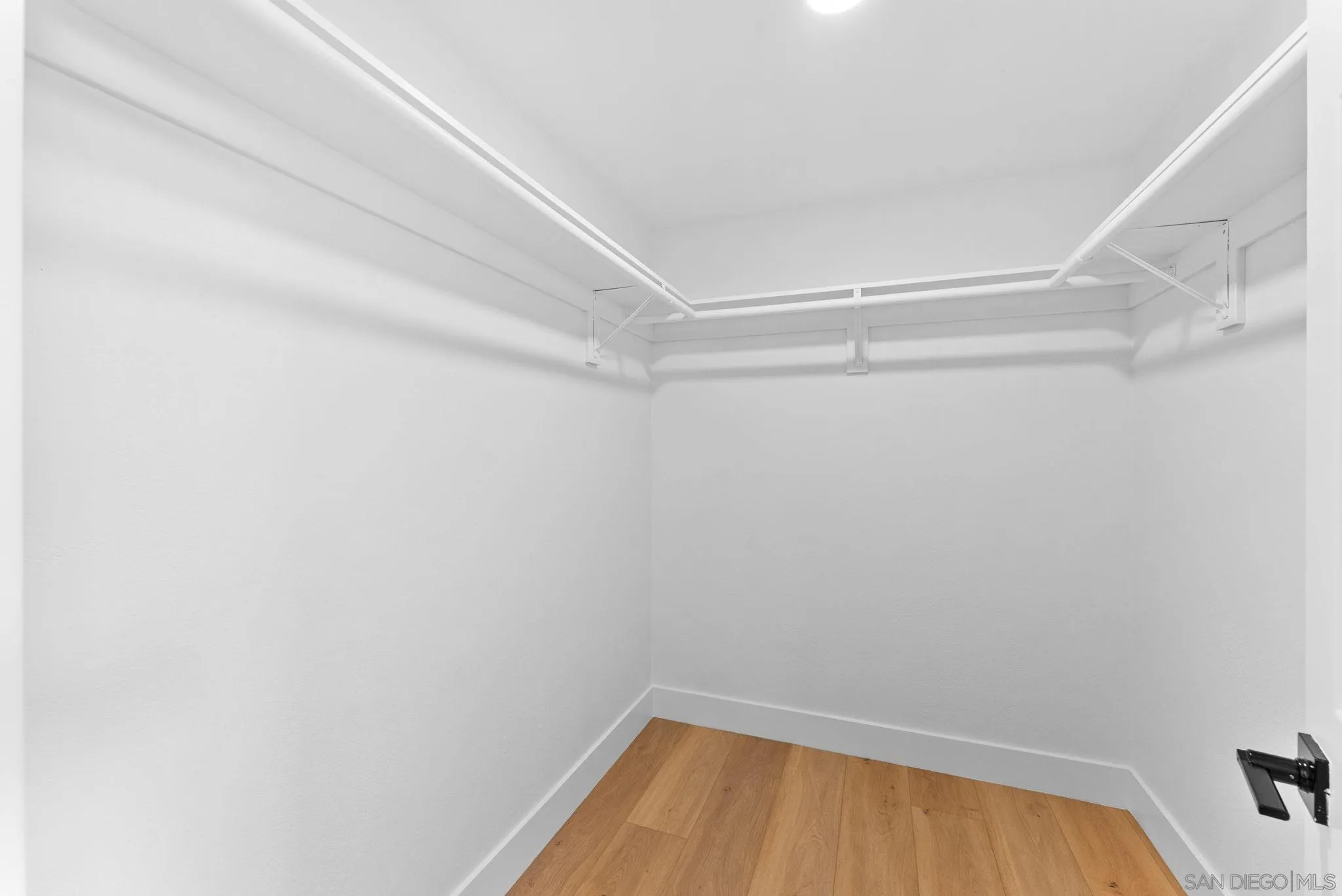 4695 Adra Way Oceanside, CA 92056 - Photo 22 of 29 a view of a room with racks on the wall