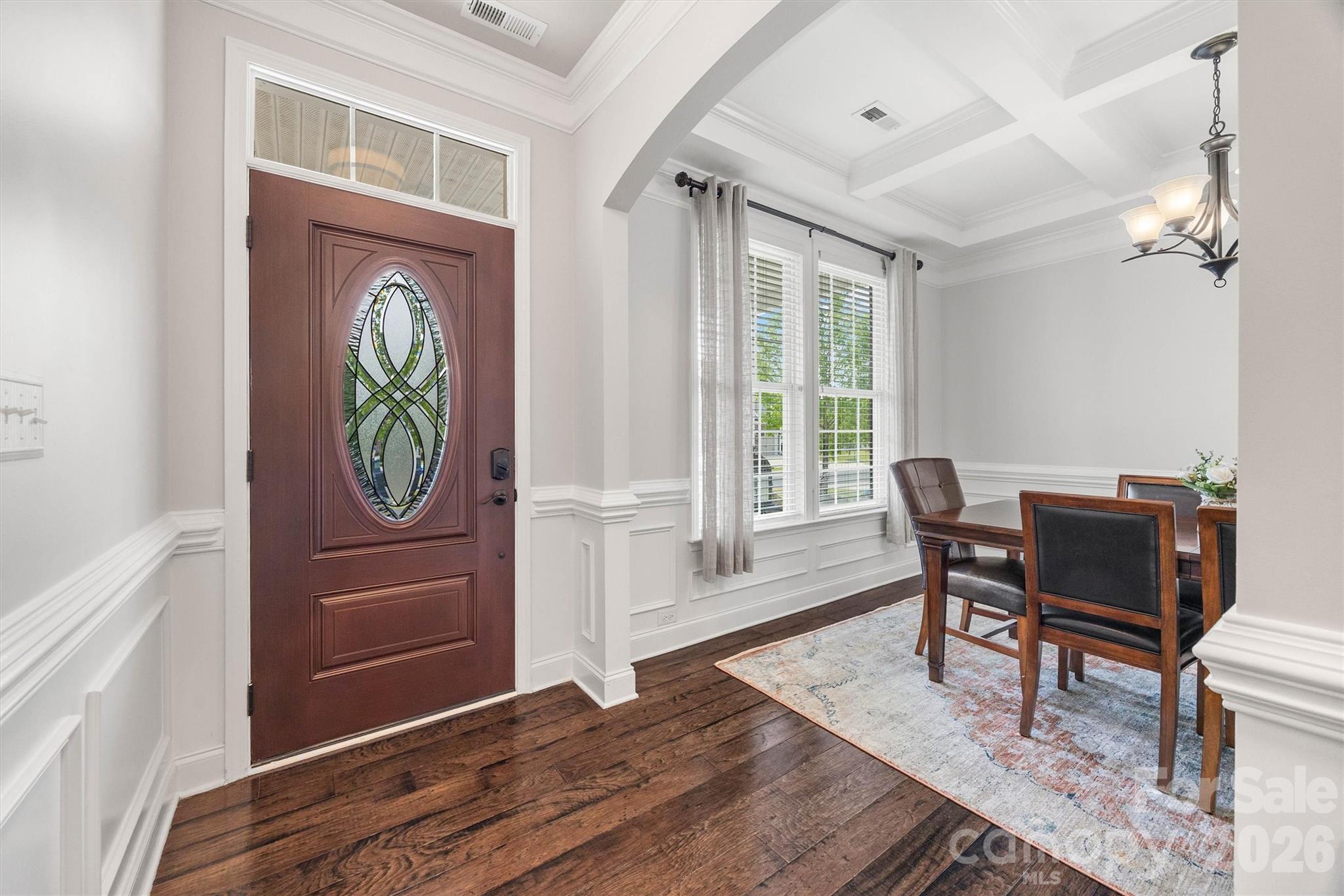 299 Annatto Way Tega Cay, SC 29708 - Photo 4 of 46 a view of a dining room with furniture window and wooden floor