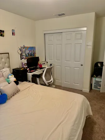 a bedroom with a bed and furniture