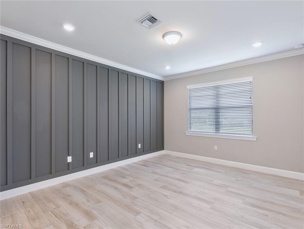 19953 Beverly Park Road Estero, FL 33928 - Photo 12 of 35 a view of an empty room with wooden floor