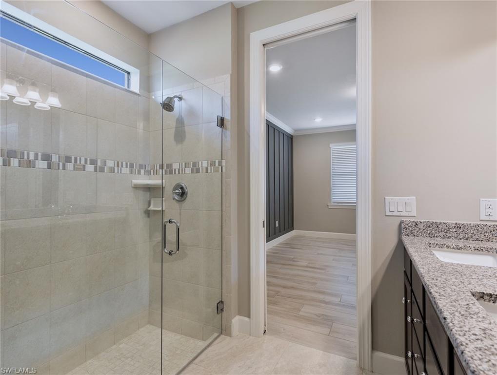19953 Beverly Park Road Estero, FL 33928 - Photo 15 of 35 a view of a bathroom from a hallway