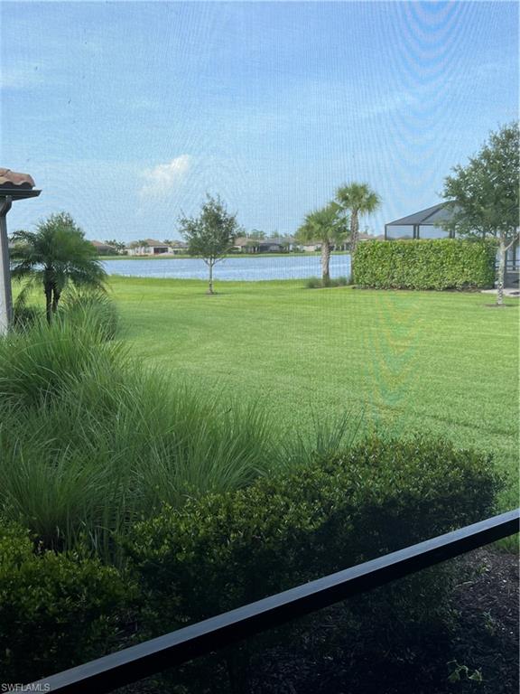 19953 Beverly Park Road Estero, FL 33928 - Photo 22 of 35 a view of a field with a tree in the background