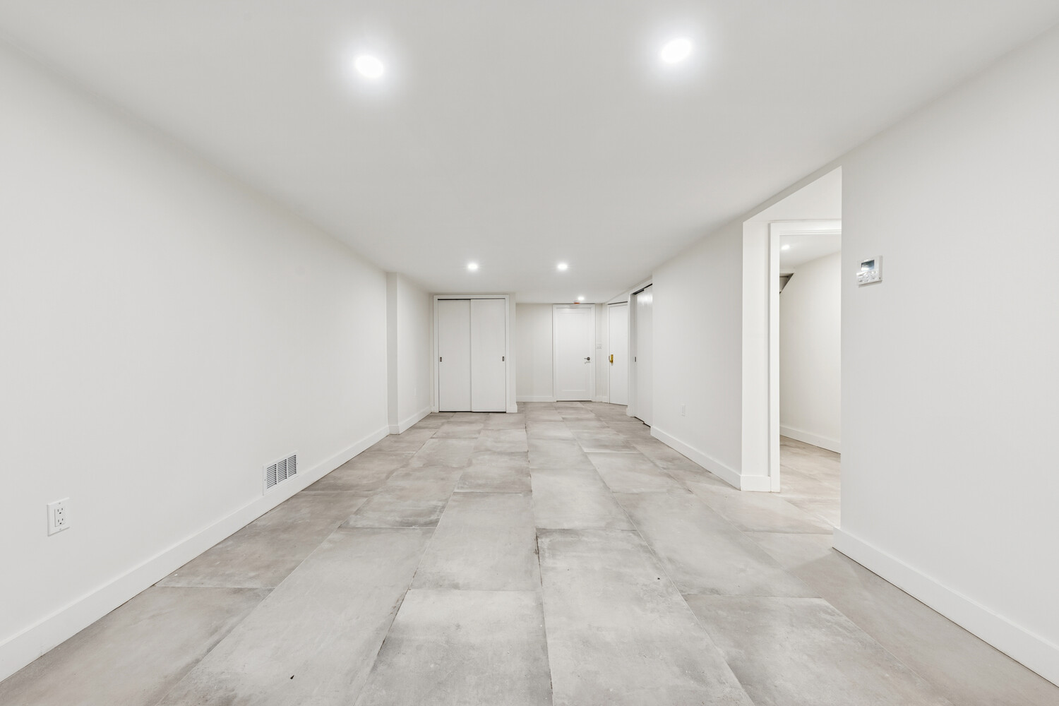 282 Convent Avenue, Unit 1 Manhattan, NY 10031 - Photo 11 of 14 an empty room with a natural light