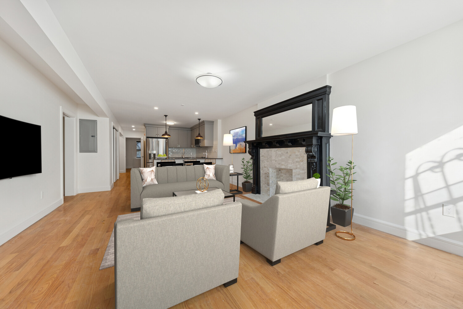 282 Convent Avenue, Unit 1 Manhattan, NY 10031 - Photo 3 of 14 a living room with furniture and a flat screen tv