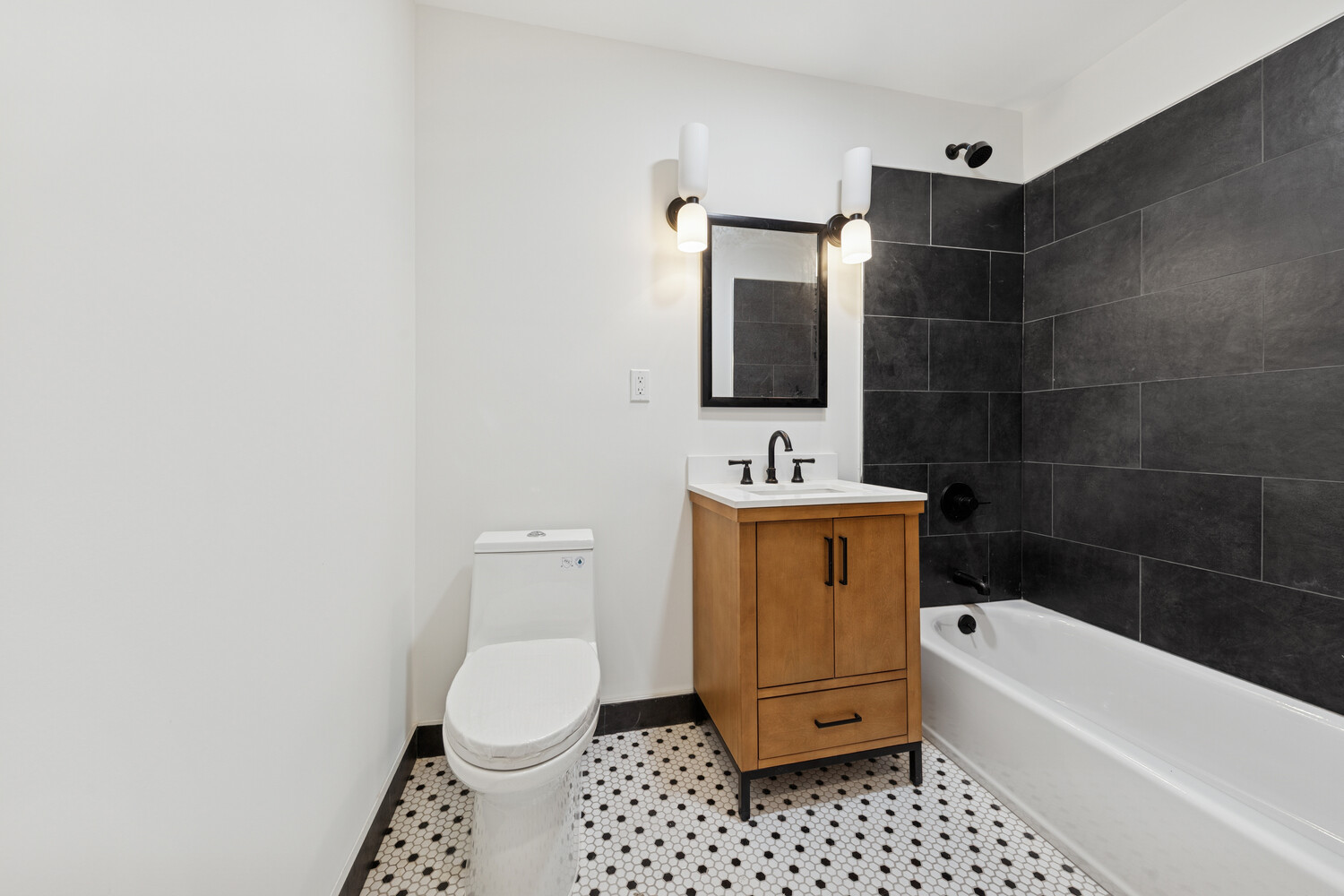 282 Convent Avenue, Unit 1 Manhattan, NY 10031 - Photo 8 of 14 a bathroom with a toilet a sink and bathtub