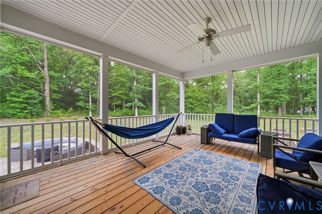 7598 Rural Point Road Mechanicsville, VA 23116 - Photo 14 of 41 a roof deck with couch and wooden floor