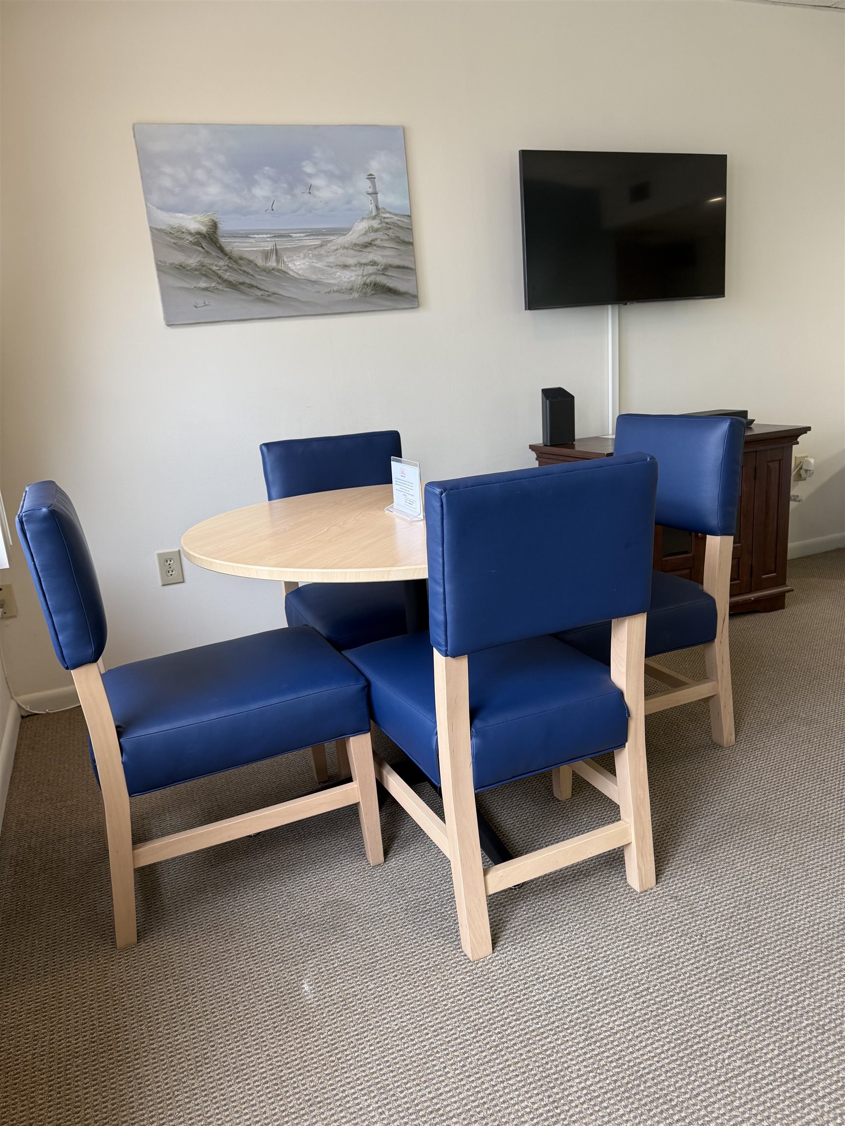 217 Beach, Unit 1 Cape May, NJ 08204 - Photo 11 of 12 a living room with furniture and a flat screen tv