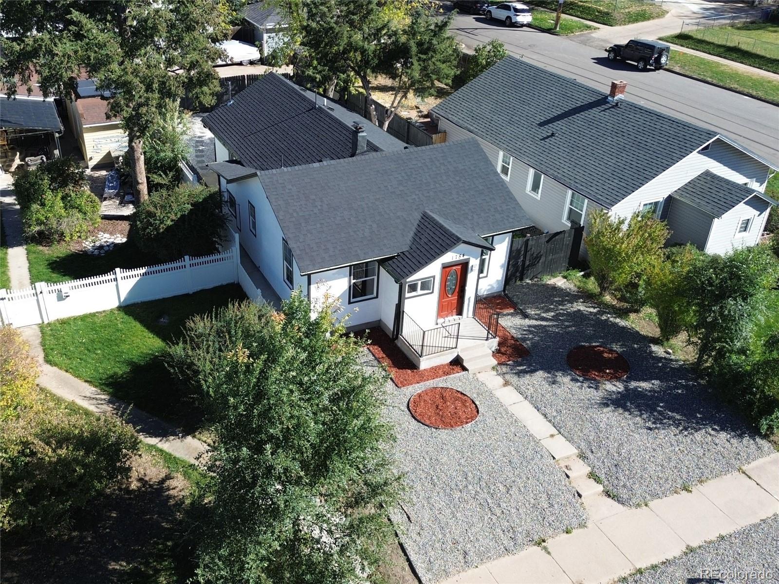 an aerial view of a house with yard