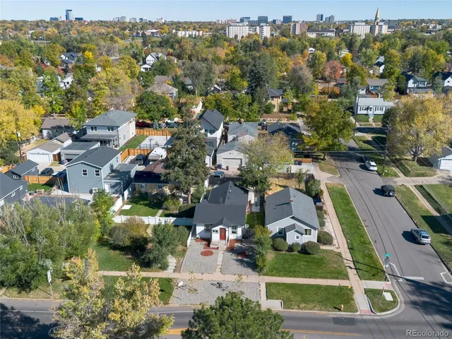 an aerial view of residential houses with outdoor space