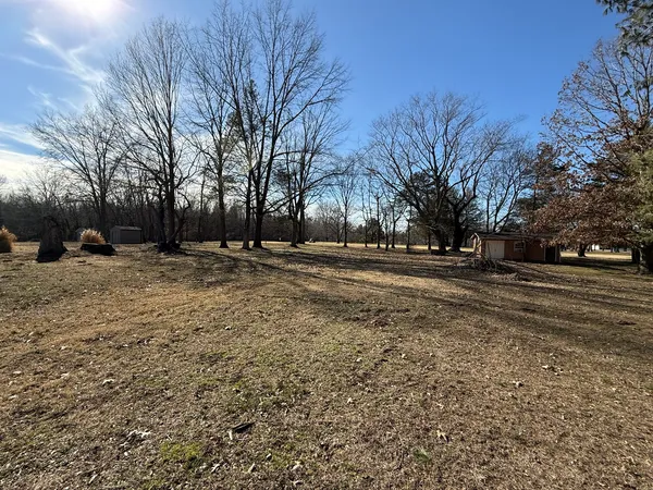 a backyard of a house with trees