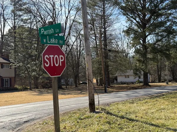 a view of water fountain with trees in the background