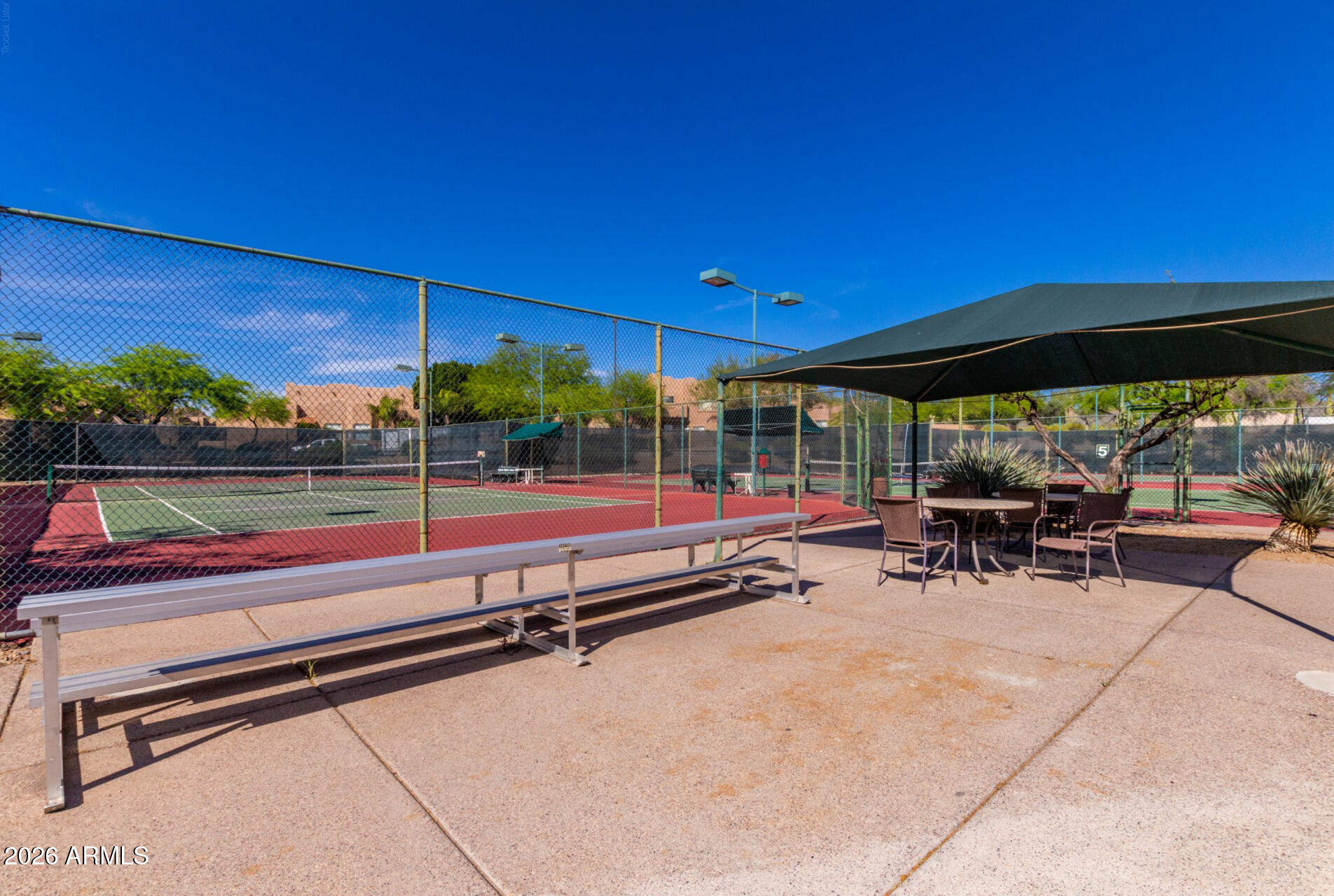3948 North Ranier Mesa, AZ 85215 - Photo 53 of 69 a view of a patio with a table and chairs under an umbrella
