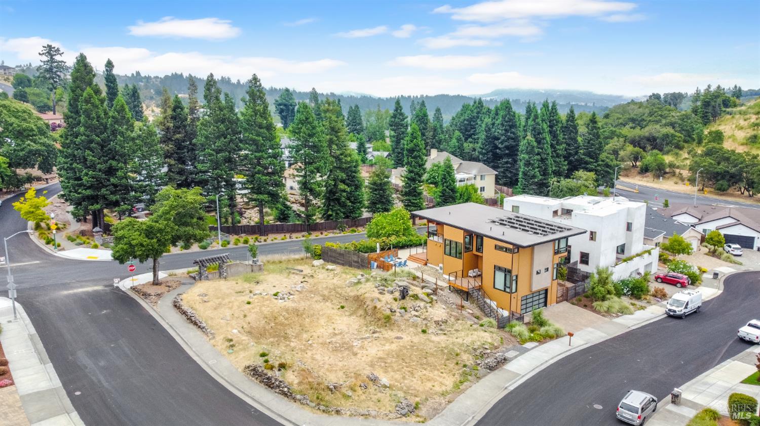 aerial view of a house with yard and green space