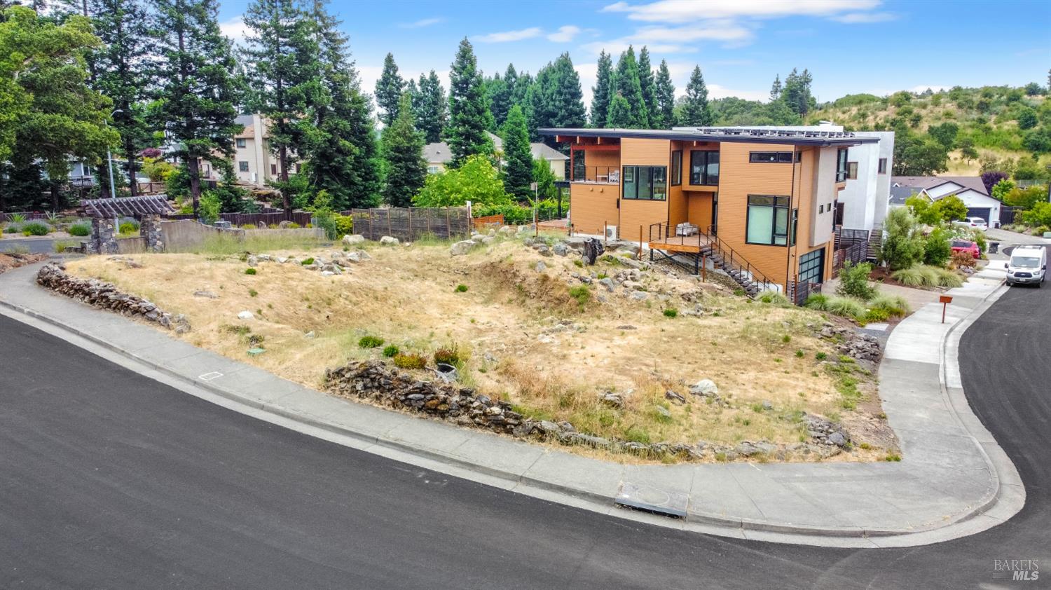 2100 Vintage Circle Santa Rosa, CA 95404 - Photo 4 of 13 a view of a house with a snow on the road and covered with trees