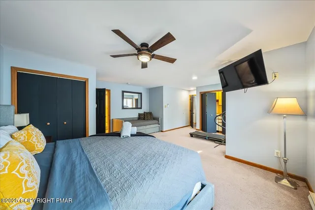 a bedroom with a bed and furniture