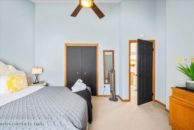 a bedroom with a bed and lamps