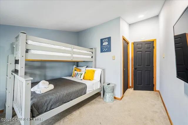 a bedroom with a bed and a cabinets