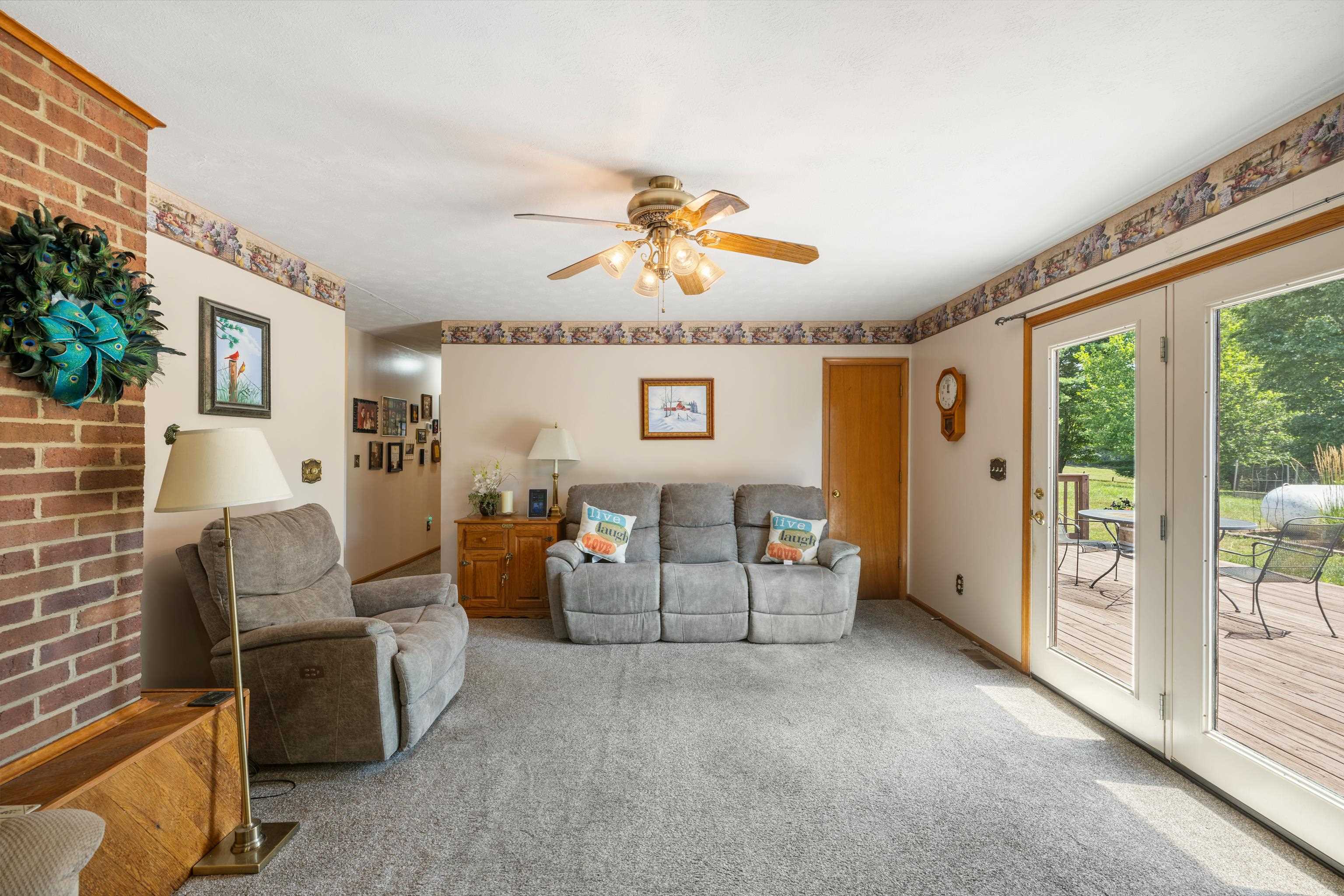 500 Varner Road Churchville, VA 24421 - Photo 11 of 64 a living room with furniture and a floor to ceiling window