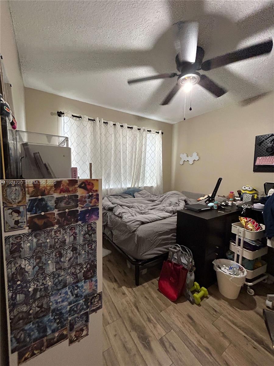 8977 Wiles Road, Unit 208 Coral Springs, FL 33067 - Photo 13 of 28 a living room with lots of furniture and decor