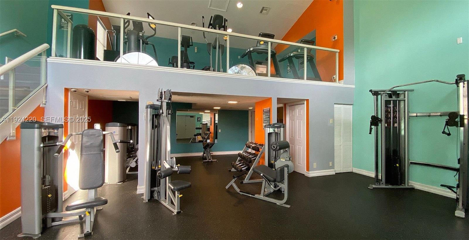8977 Wiles Road, Unit 208 Coral Springs, FL 33067 - Photo 21 of 28 a view of a house with gym equipment