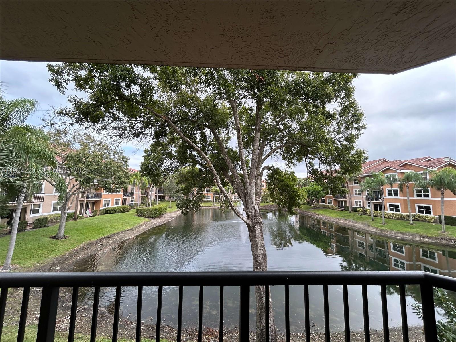 8977 Wiles Road, Unit 208 Coral Springs, FL 33067 - Photo 3 of 28 a view of a city from a balcony
