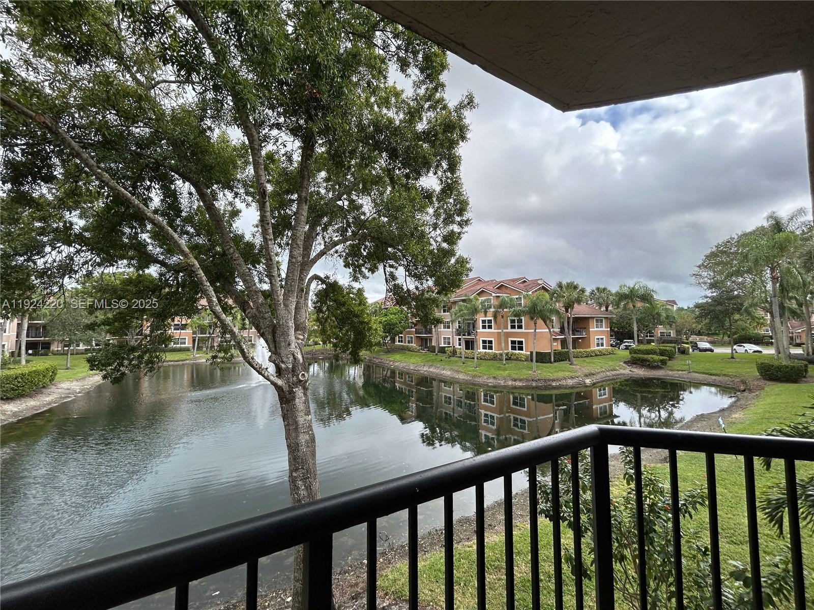 8977 Wiles Road, Unit 208 Coral Springs, FL 33067 - Photo 4 of 28 a view of city from a lake
