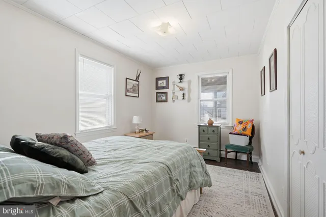 a bedroom with a bed and a closet