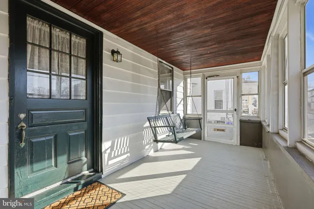 a balcony view with a couch and table