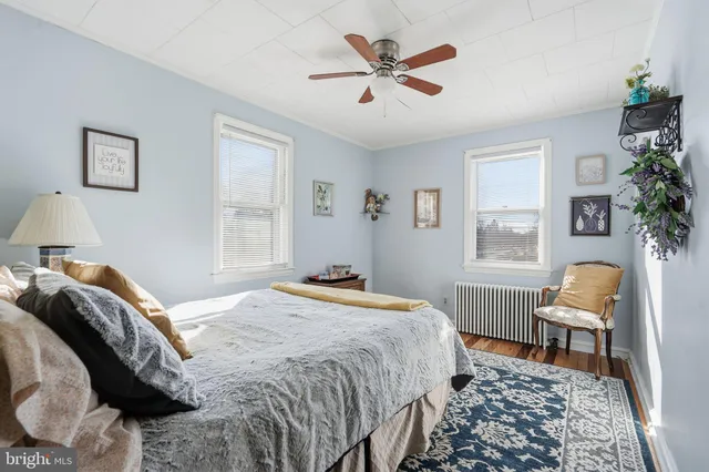 a bedroom with a bed and a chair