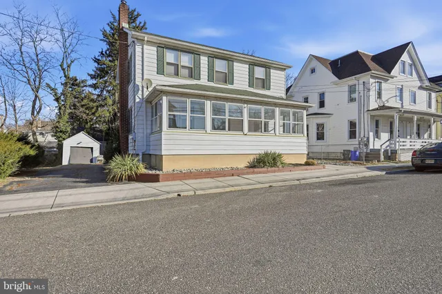 a front view of a building with a street
