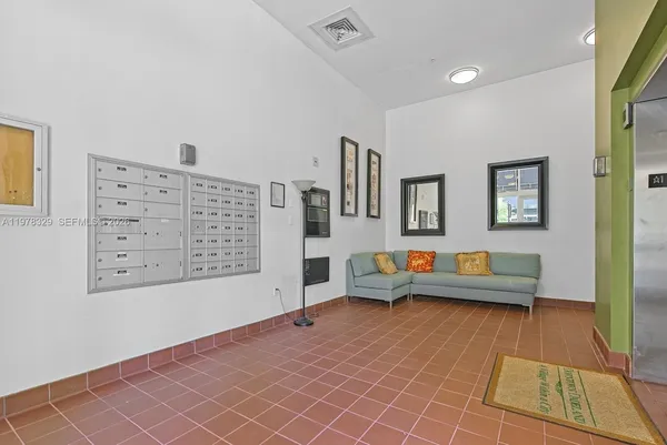 a living room with furniture and a rug