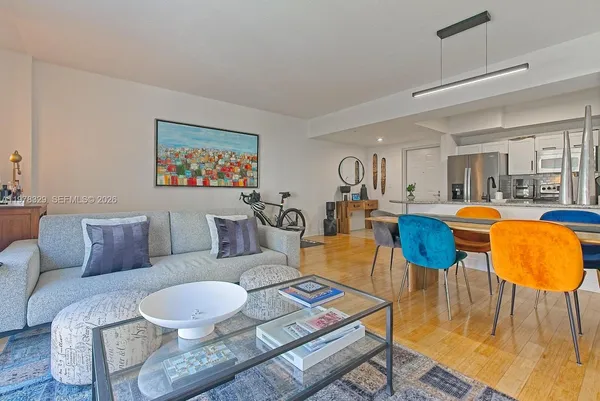 a living room with furniture and a rug