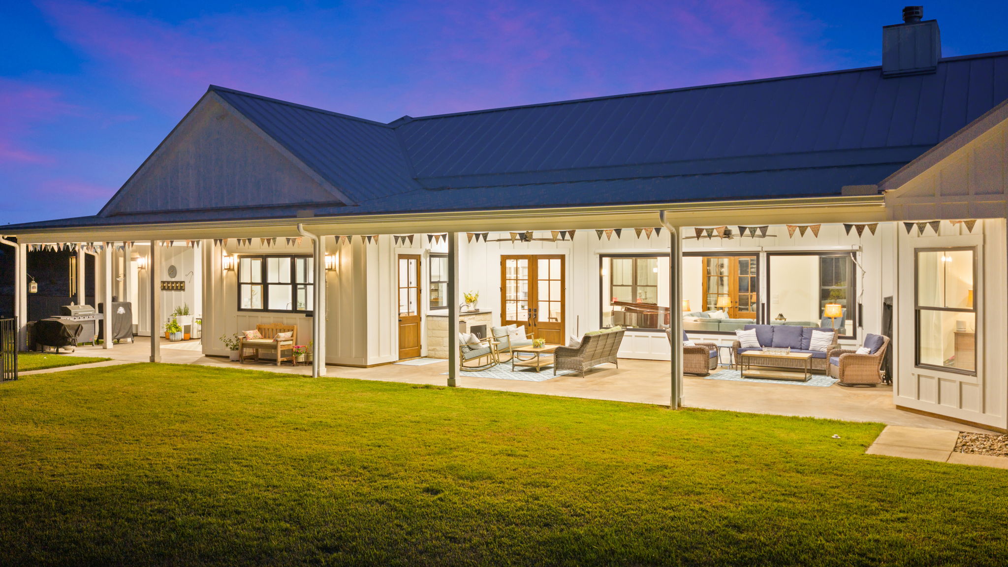 452 Southwick Ranch Road Johnson City, TX 78636 - Photo 28 of 40 A spacious covered patio offers ample room for relaxation and entertaining, overlooking a well-maintained lawn.
