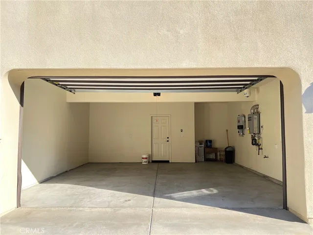 a view of a couches and table in the backyard