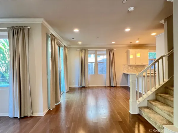 a view of an entryway with wooden floor