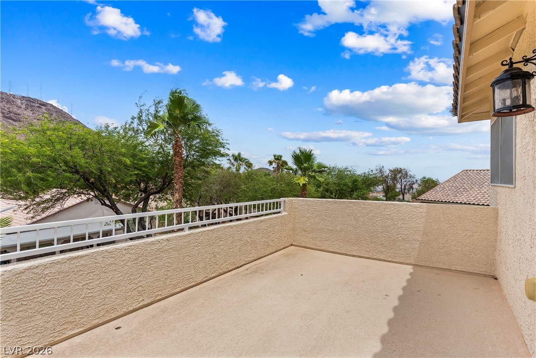 708 Vortex Avenue Henderson, NV 89002 - Photo 37 of 71 Desert mountain views and vibrant palm trees complement this private, sun-drenched balcony.
