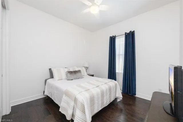 a bedroom with a bed and a mirror