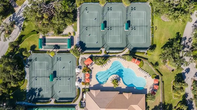 an aerial view of residential house with outdoor space and swimming pool
