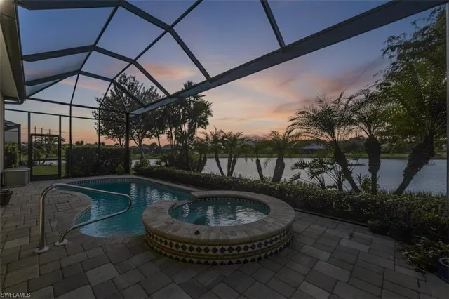 a living room with furniture a flat screen tv and kitchen view