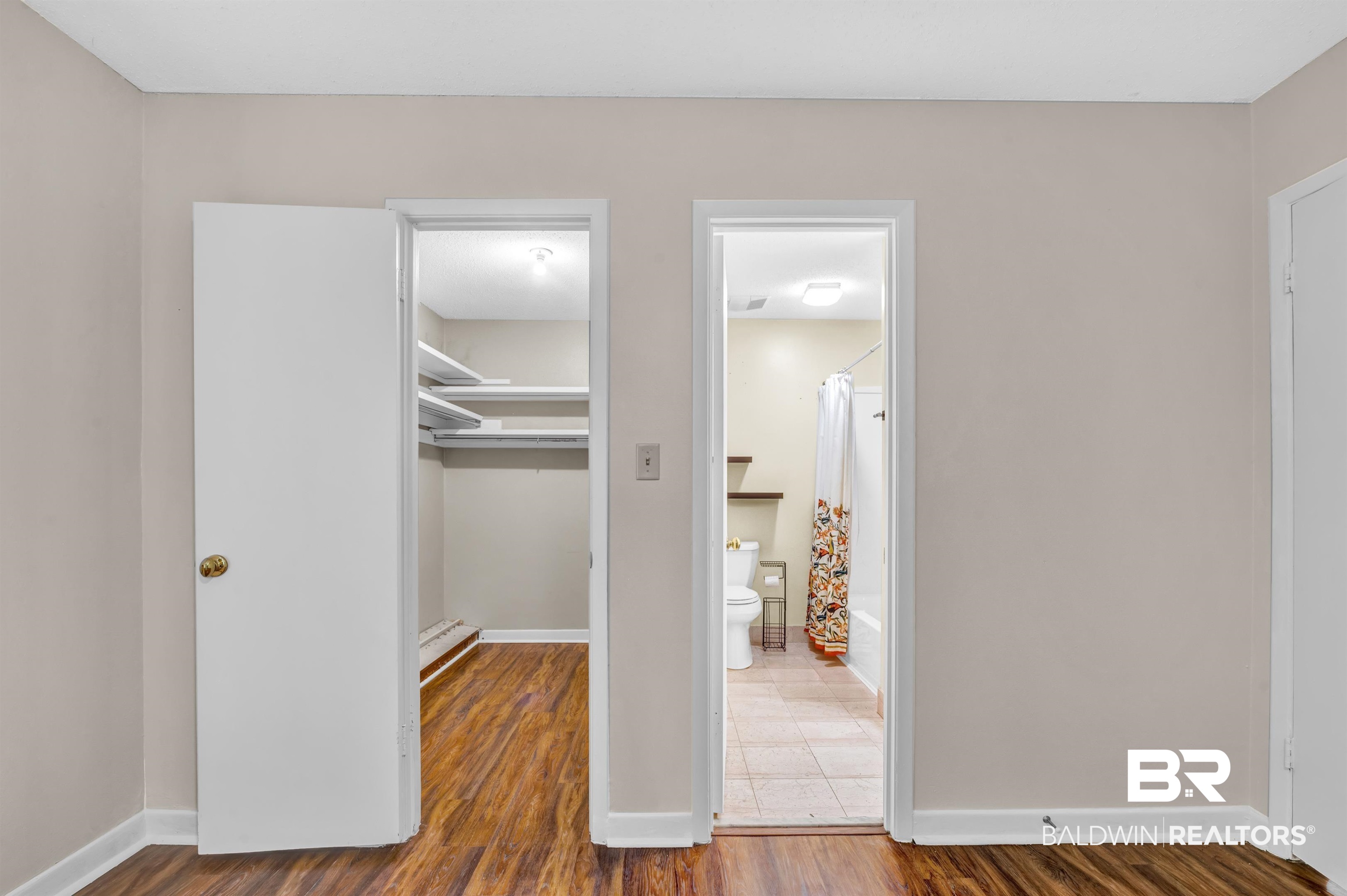 28 Caisson Trace Spanish Fort, AL 36527 - Photo 25 of 51 finished floors, closet, a walk in closet, and baseboards