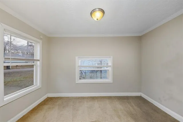 a view of an empty room and window