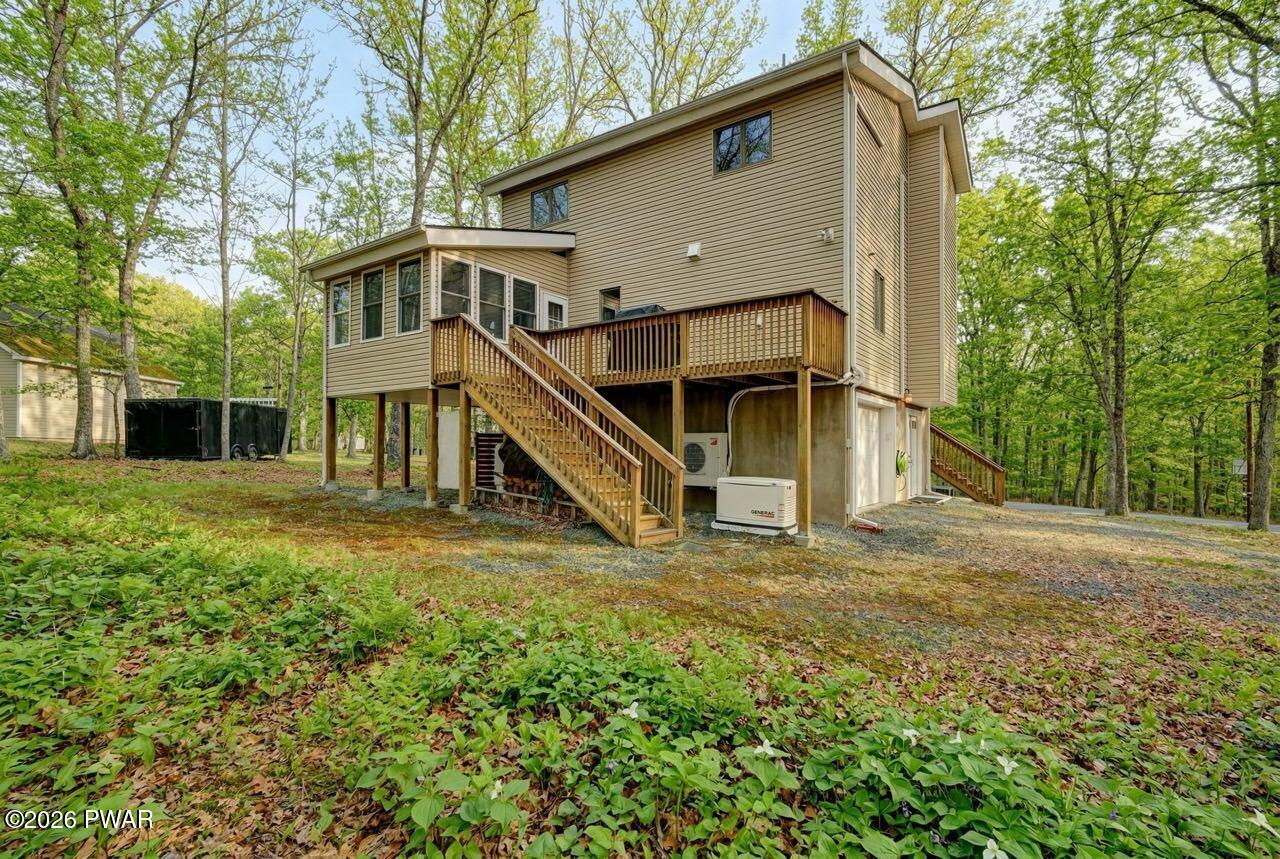 258 Lakeview Road Lackawaxen, PA 18435 - Photo 10 of 119 a house with trees in front of it