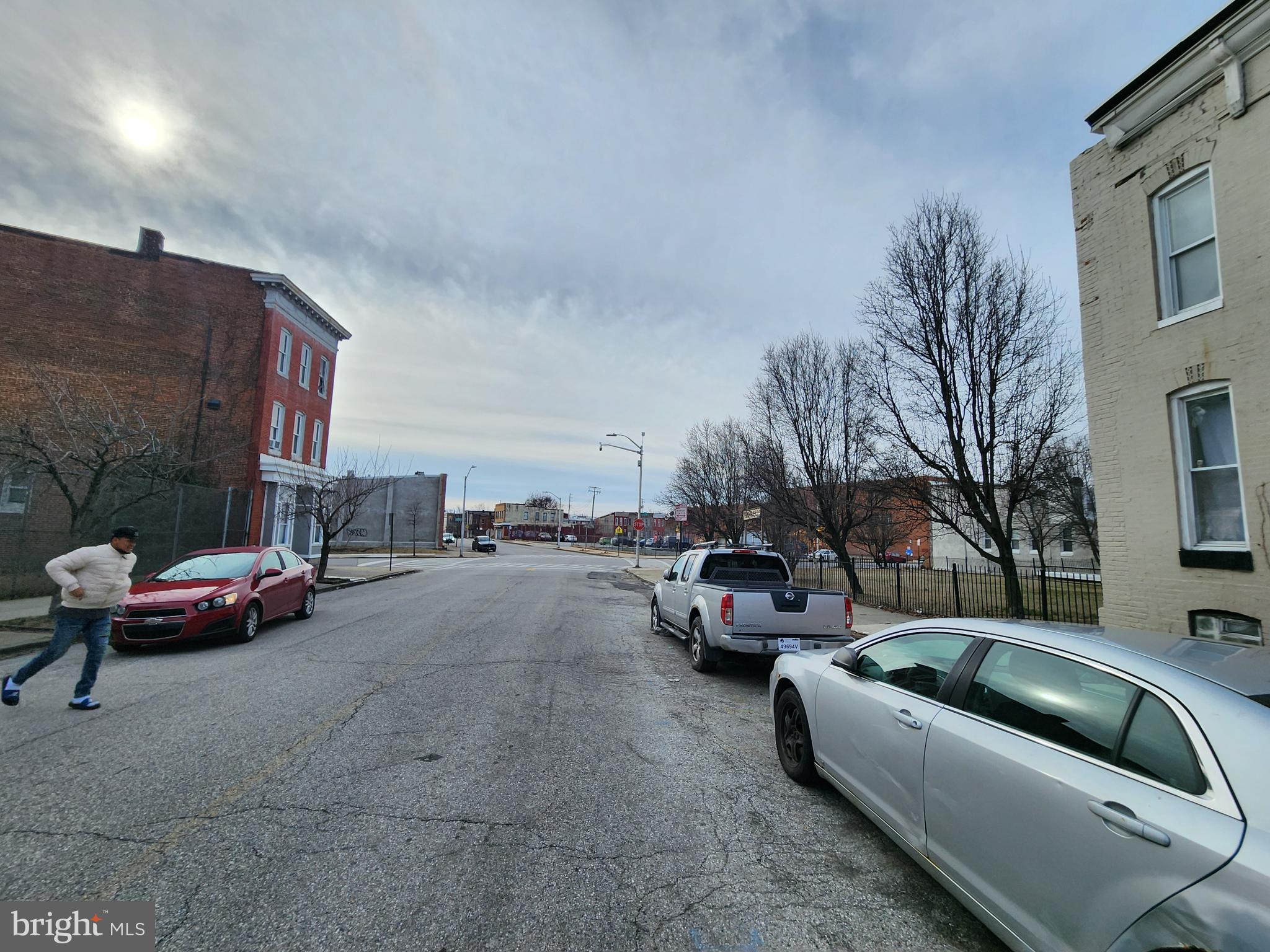 406 South Pulaski Street Baltimore, MD 21223 - Photo 3 of 4 a view of street with parked cars