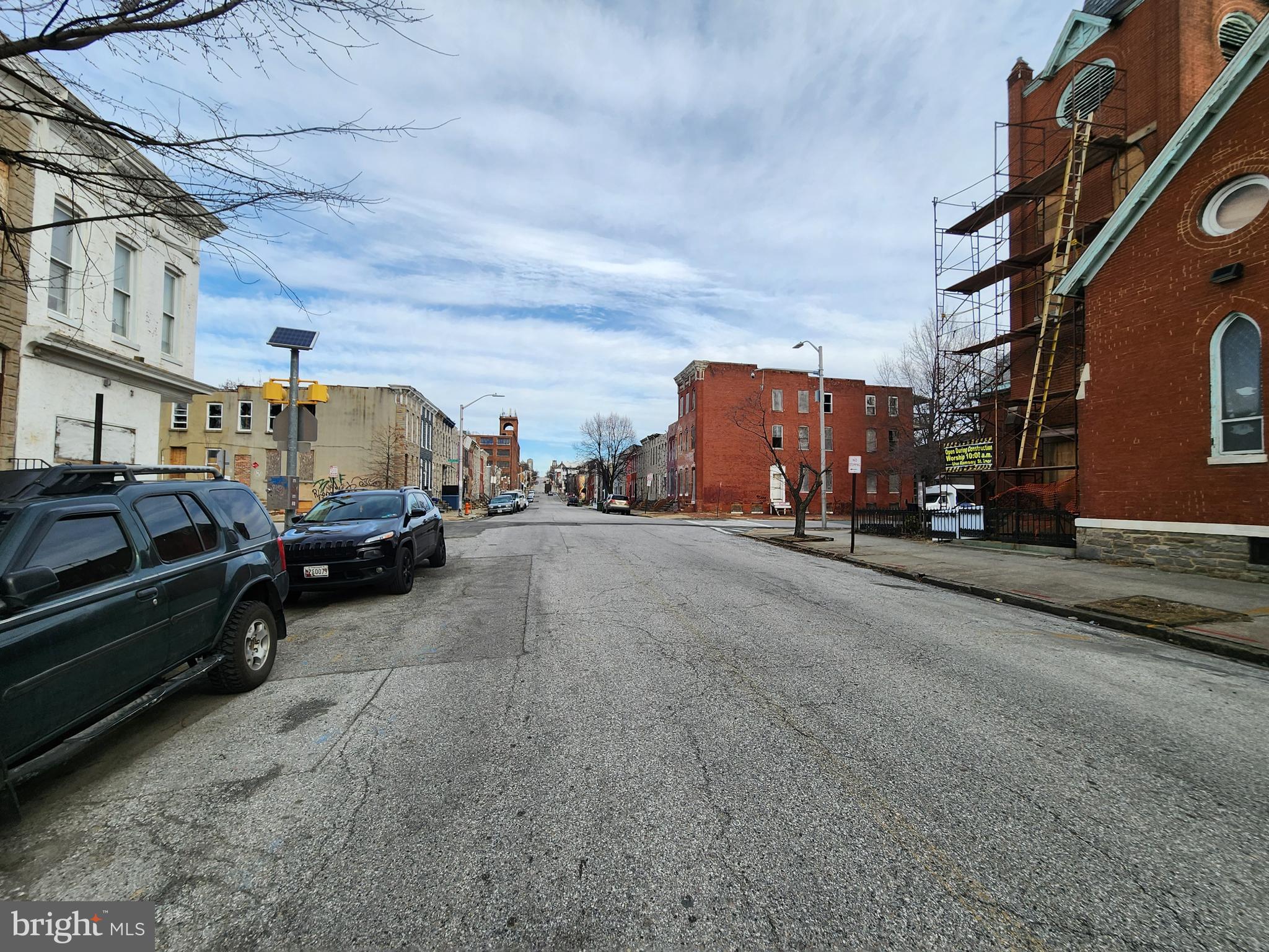 406 South Pulaski Street Baltimore, MD 21223 - Photo 4 of 4 a view of a cars park in front of a building