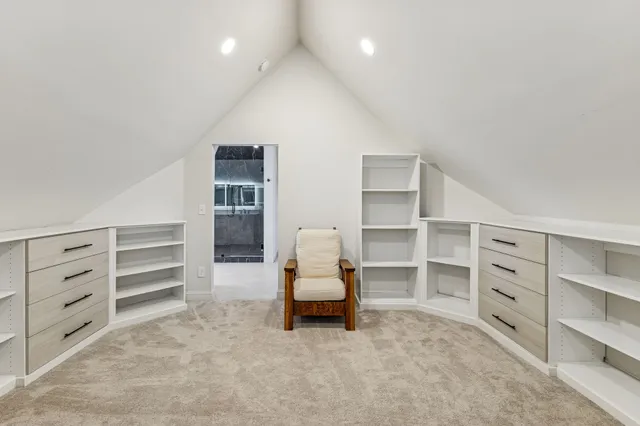 a bedroom with a bed and a walk in closet