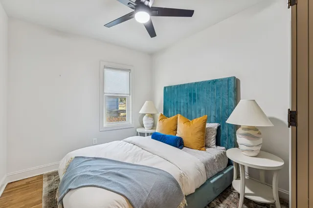 a bedroom with a bed and a lamp