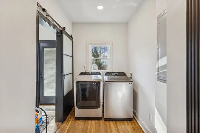 a living room with furniture a air conditioner and a window